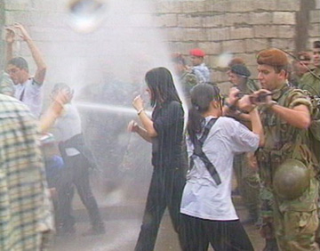 Lebanese youth demonstrating against Syrian occupation faced by violent security forces