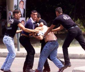 Civilians protected by Syrian troops and their proxy regime in Lebanon attack Lebanese student