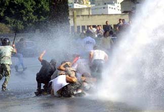 Lebanese youth demonstrating against Syrian occupation faced by violent security force